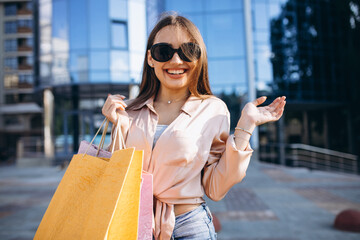 Young woman by the shopping center