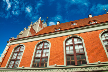 Fototapeta na wymiar Red brick landmark facade in central Riga, Latvia.