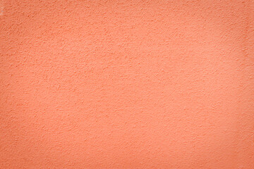 Fototapeta premium Orange abstract background. Painted orange color wall stucco texture. 