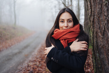 Portrait of a beautiful young woman in a cold Autumn day