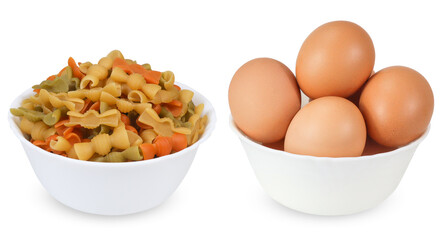 Pasta and eggs on an isolated white background. Colored pasta