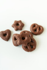 Gingerbread in chocolate lies on a white table. Place for an inscription.