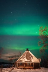 Selbstklebende Fototapeten Northern Lights, aurora borealis over Abisko, Swedish Lapland. © ronnybas