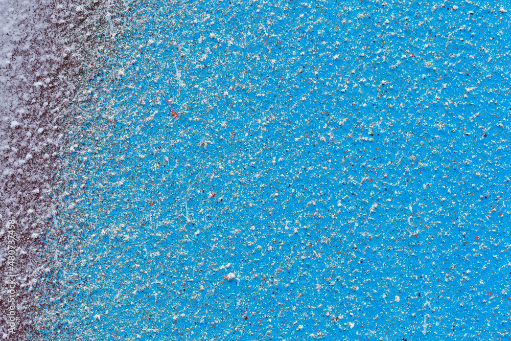 Poster macro close-up of light blue and dark red spray paint with white and colorful splashes. abstract ful