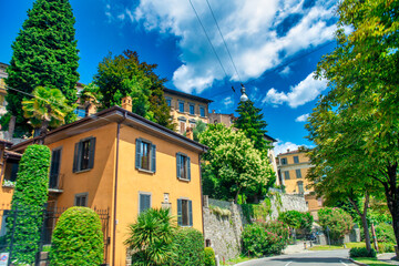 Buildings and park of Bergamo Alta, Italy. - obrazy, fototapety, plakaty
