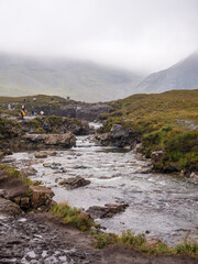 Fairy pools waterfalls shrouded in heavy mist at Glenbrittle, Isle of Skye, Scotland, Uk
