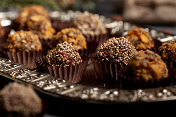 Various homemade raw vegan truffles or energy balls such as almonds and cocoa, dark chocolate and hazelnut butter
