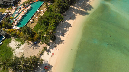Phi Phi Don, Thailand. Overhead aerial view of Phi Phi Island coastline and beach from drone on a hot sunny day.