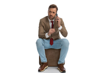 businessman talking on the phone and listening very carefuly