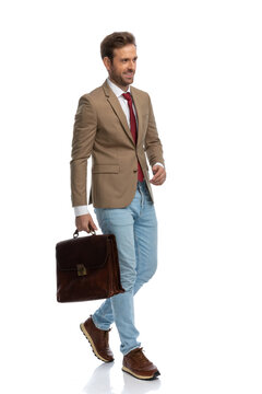 handsome businessman walking on his way with a briefcase
