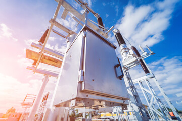 Construction of a power transmission substation on a background of blue sky