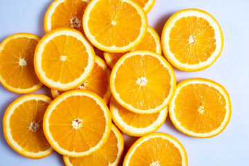 Fresh slised oranges on white background. Top view.