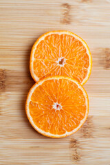 sliced orange on wooden table