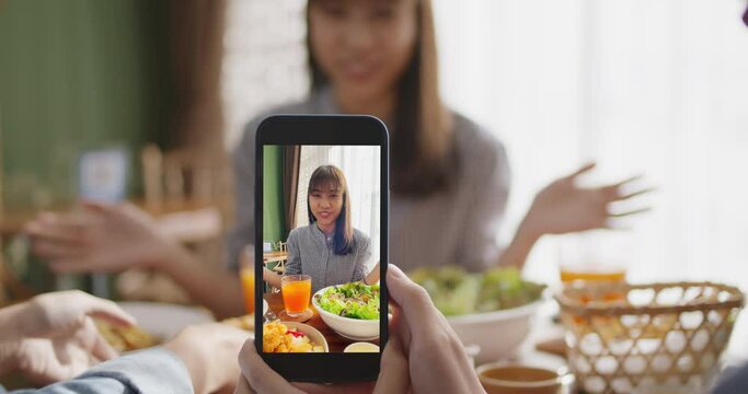 Asia teen girl vlogger talk show share on viral vlog fun speak smile look camera for IG reel instagram tiktok mobile app. Gen z youth people enjoy eat happy meal on modern vegan retail cafe table.