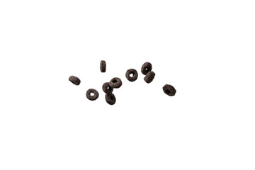 Chocolate rings cereal spill out into a bowl. Breakfast.