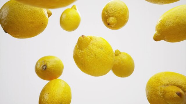 Lemons. Сamera flyby slowmo b-roll on white background. Bullet time close-up arc shot