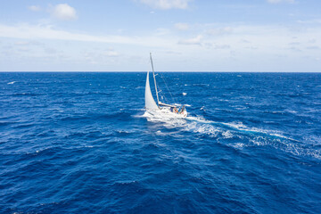 Sailing vessel on open water under clear skies in the atlantic ocean