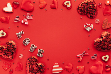 Valentine's day or Wedding romantic concept with Red hearts on red background. Top view, copy space.