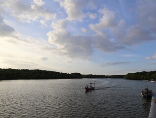 Fototapeta na wymiar boat on the river during sunset