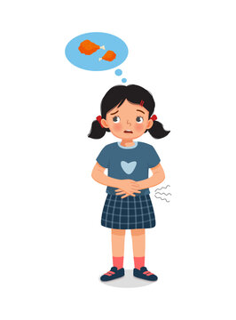 cute little girl feeling so hungry holding her stomach thinking of eating fried chicken