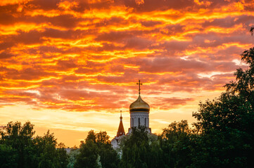 church on the background of a red sunset, a symbol of religion