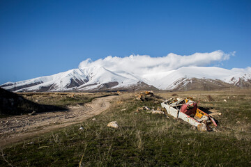 landscape with snow and a car wreck
