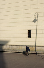Old lady walking on the street