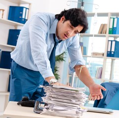 The young male employee in blood transfusion concept