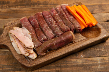 beef roll raw to prepare with bacon and carrots