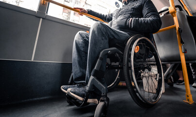 Fototapeta premium Person with a physical disability inside public transport with an accessible ramp.