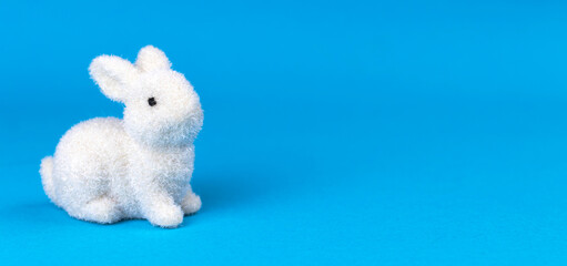 Easter bunny on bright blur background, banner design, postcard or greetings concept, copy space photo