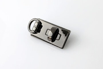 Metallic decorative element for women's bags. A decorative element for the outer part of the bag....