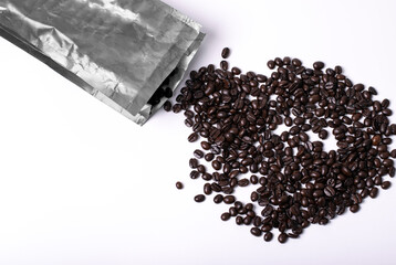 bag with coffee beans on white background