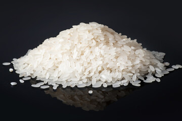 Pile white rice on black background. close up