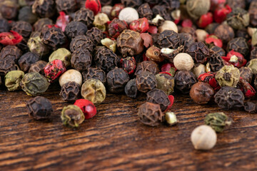 Colored peppers mix on the wooden background