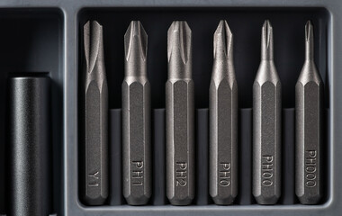 Set of bits for screwdriver. Metal bits for screwdriver. Tool set for household use. Nozzles and adapters for screwdrivers. Head different size hex driver.