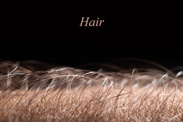 Human skin with hair on black background. Goose bumps
