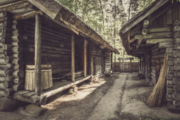 Fototapeta na wymiar Barnyard. Old house in forest. Open-air ethnography museum near Riga, Latvia