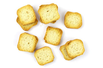 Square white bread croutons top view. Croutons on a white background. Wheat mini croutons for...