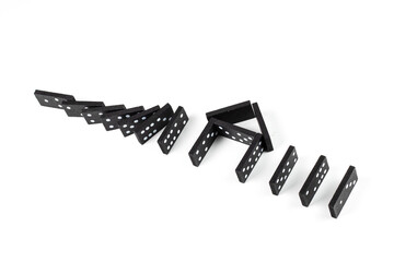 Black Domino on white background. Falling dominoes on the house. Domino effect, Hobbies and...