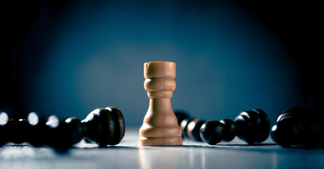 Victory, defense and self-confidence concept. White rook is the last chess piece standing. - obrazy, fototapety, plakaty