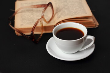 A cup of coffee and a book