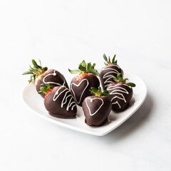 Chocolate covered strawberries with selective focus on the front middle one.