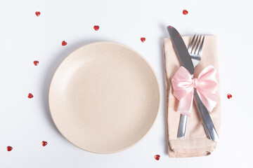 Top view cutlery and empty plate on the table. Serving for a romantic dinner on valentines day concept