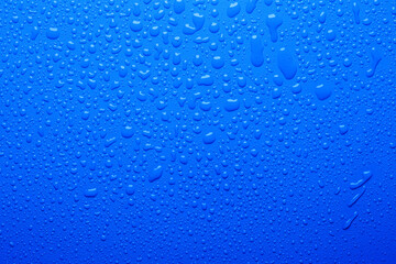 Water drops on blue color  surface