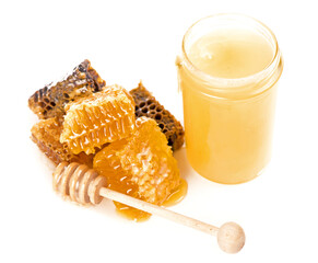 linden and buckwheat honey. Honeycomb with jar and honey dipper isolated on white background
