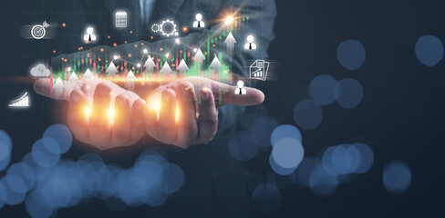 Businessman holding growth graph for business. Trading stock, Marketing strategy and analysis for profit business to the future. Investment, financial, accounting, and technology concepts.