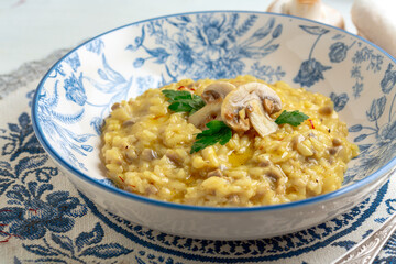 Mushroom and saffron risotto close-up.