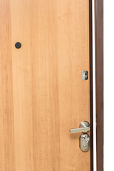 Wooden door entrance with iron handle, key lock hole and peephole