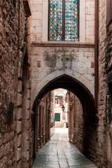 Fototapeta na wymiar Ancient street passage view of Diocletian's Palace in old town of Split, Croatia